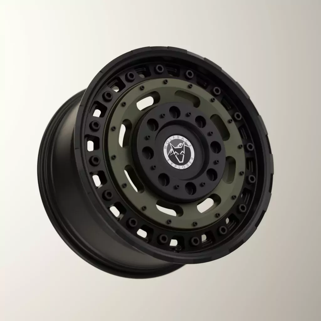 A 3D digital rendering of a rugged Wolfrace Explorer Slotmag alloy wheel, showcasing a matt black outer rim with perimeter rivets, a tactical olive green center face, and a central white and black wolf logo cap.