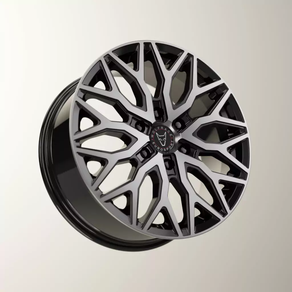 A 3D digital rendering of a Wolfrace Eurosport alloy wheel, featuring a glossy black inner barrel and a complex geometric, diamond-cut mesh spoke pattern with a red and black wolf center cap.